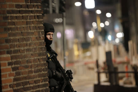 A policeman is seen along a street in central Copenhagen, early February 15, 2015 following shootings at a synagogue in Krystalgade. REUTERS/Martin Sylvest/Scanpix Denmark