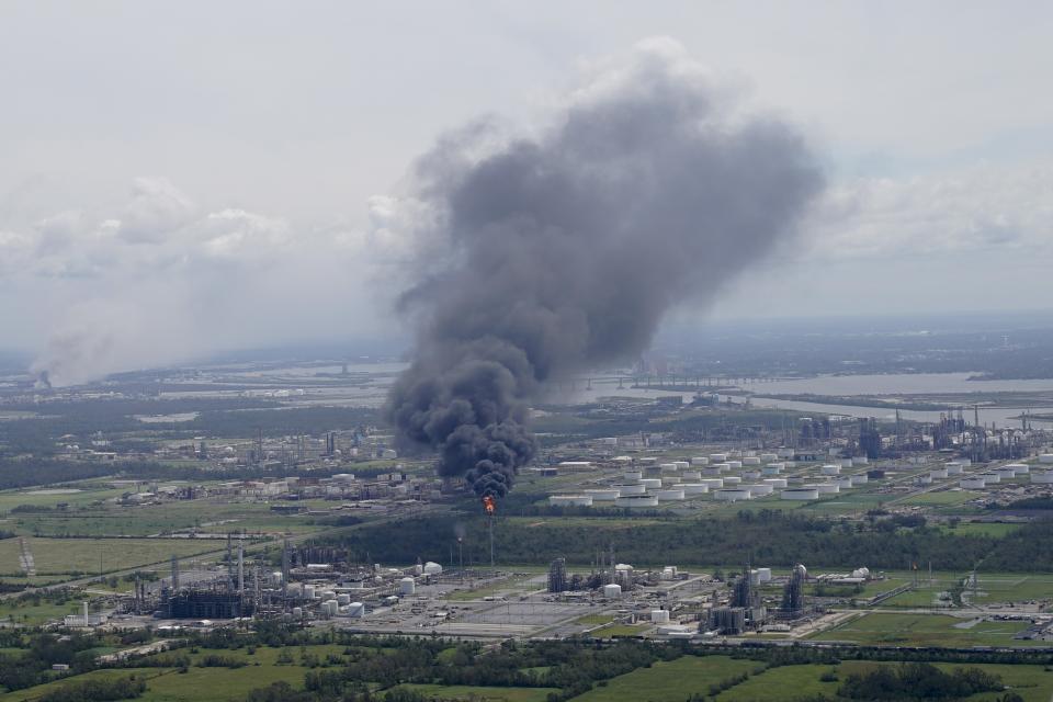 A chemical fire burns at a facility during the aftermath of Hurricane Laura Thursday, Aug. 27, 2020, near Lake Charles, La. (AP Photo/David J. Phillip)