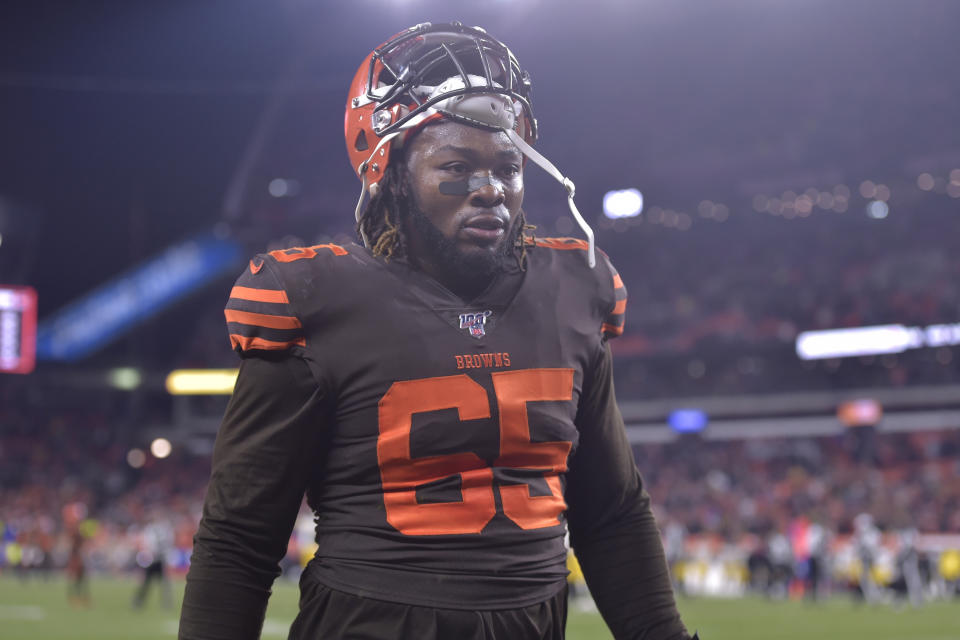 File-This Nov. 14, 2019 file photo shows Cleveland Browns defensive tackle Larry Ogunjobi walking off the field after he was ejected late in the fourth quarter of an NFL football game against the Pittsburgh Steelers in Cleveland. The one-game NFL suspension for Ogunjobi for his role in the brawl with the Pittsburgh Steelers was upheld by an appeals officer. Ogunjobi shoved Pittsburgh quarterback Mason Rudolph to the ground moments after Cleveland teammate Myles Garrett swung a helmet and struck the Steelers QB in the head. Garrett was suspended indefinitely by the league for his alarming assault. His appeal was heard in New York on Wednesday, Nov. 20, 2019. (AP Photo/David Richard, File)