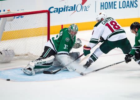 Apr 14, 2016; Dallas, TX, USA; Dallas Stars goalie Kari Lehtonen (32) stops a shot by Minnesota Wild center Ryan Carter (18) during the third period in game one of the first round of the 2016 Stanley Cup Playoffs at American Airlines Center. The Stars shut out the Wild 4-0. Jerome Miron-USA TODAY Sports