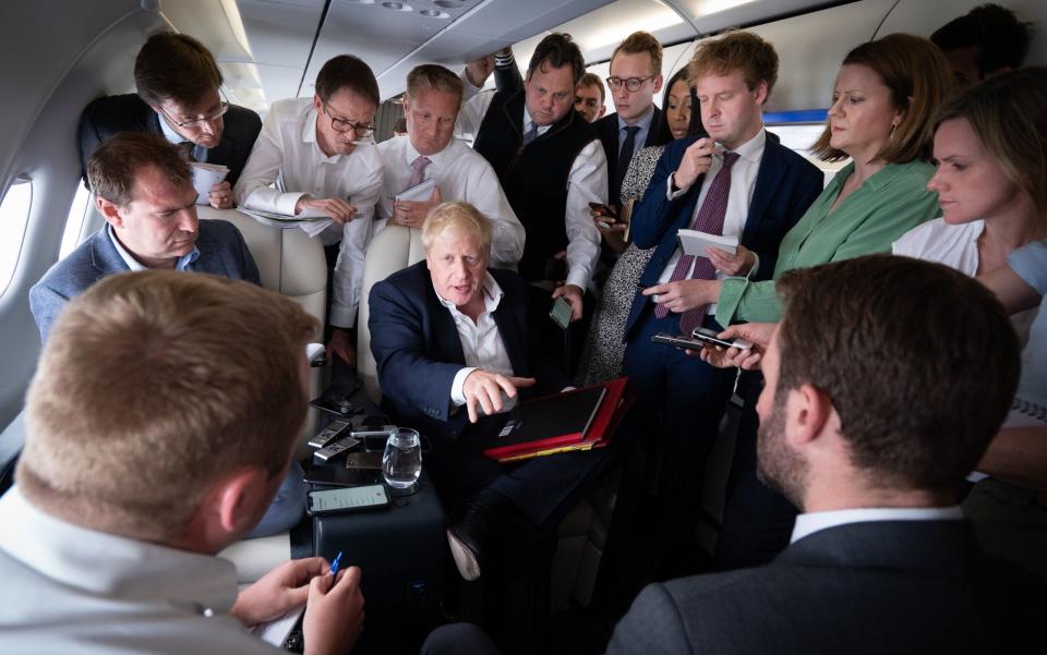 Boris Johnson, the Prime Minister, speaks to journalists on the way to the Nato summit - Stefan Rousseau 