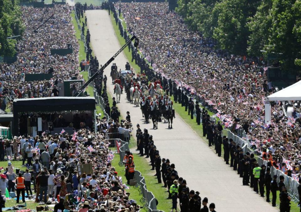 Crowds cheering newlyweds Prince Harry and Meghan Markle