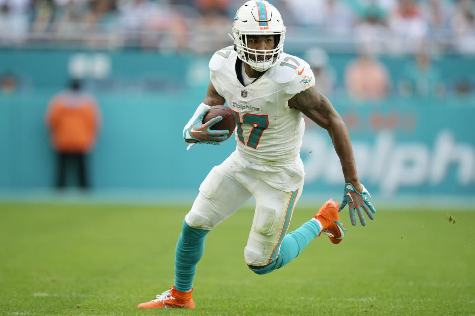 Miami Dolphins wide receiver Jaylen Waddle (17) runs with the ball during the second half of an NFL football game against the New York Jets, Sunday, Dec. 17, 2023, in Miami Gardens, Fla. (AP Photo/Rebecca Blackwell)