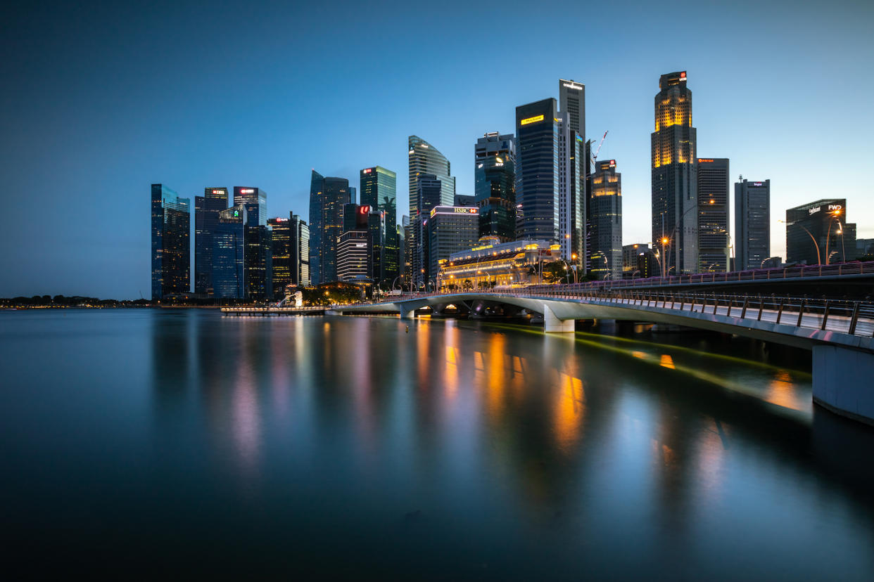 Singapore downtown district at dusk (Photo: Getty Images)