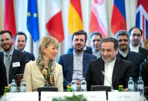 Tehran's deputy foreign miniser Abbas Araghchi (R) and EU External Action Service secretary general Helga Schmid at the joint commission on the Iran nuclear deal