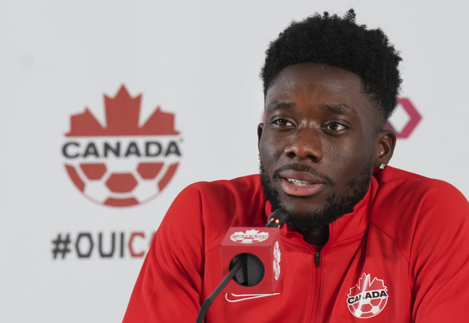 Canada forward Alphonso Davies speaks to the media after practice at the World Cup soccer tournament in Doha, Qatar on Tuesday, Nov. 29, 2022. (Nathan Denette/The Canadian Press via AP)