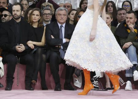 Actress Natalie Portman (2ndL), her husband Benjamin Millepied and Sidney Toledano (R), Chief Executive of Christian Dior attend Belgian designer Raf Simons Haute Couture Spring Summer 2015 fashion show for French fashion house Christian Dior in Paris January 26, 2015. REUTERS/Gonzalo Fuentes