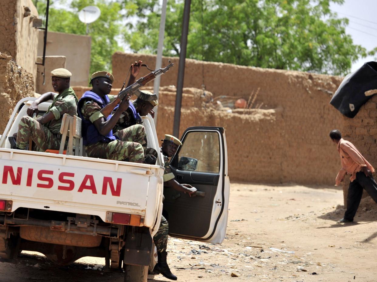 <p>Soldiers on patrol in northern Burkina Faso, which has been targeted by jihadists over the past five years.</p> (AFP via Getty Images)