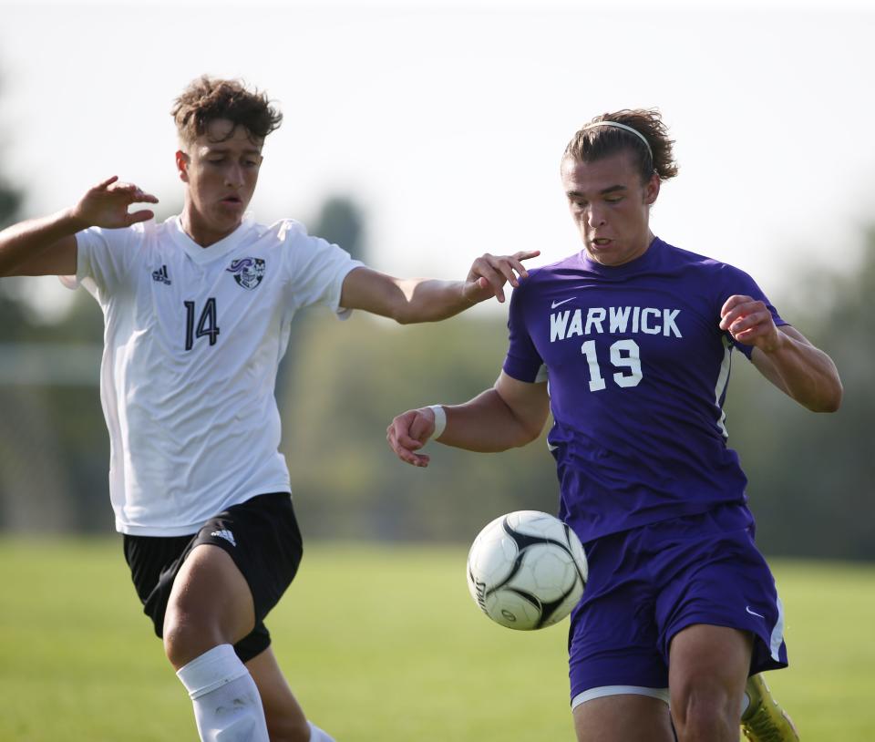 Warwick's Kayden Zachgo gets the ball under control as Monroe-Woodbury's Ibrahim Cela covers him during Wednesday's boys soccer game on September 21, 2022.