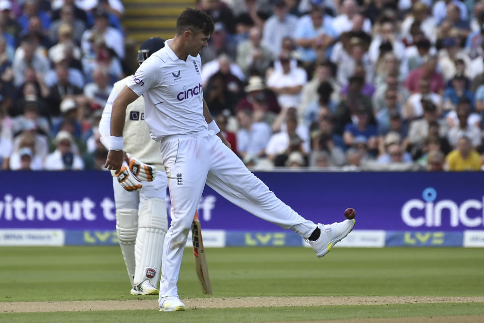England's James Anderson kicks the ball during the first day of the fifth cricket test match between England and India at Edgbaston in Birmingham, England, Friday, July 1, 2022. (AP Photo/Rui Vieira)