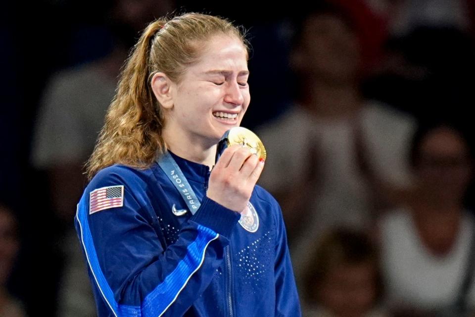 Aug 6, 2024; Paris, France; Amit Elor (USA) celebrates her win over Meerim Zhumanazarova (Kyrgyzstan) in the gold medal match during the Paris 2024 Olympic Summer Games at Champ-de-Mars Arena. Mandatory Credit: Sarah Phipps-USA TODAY Sports