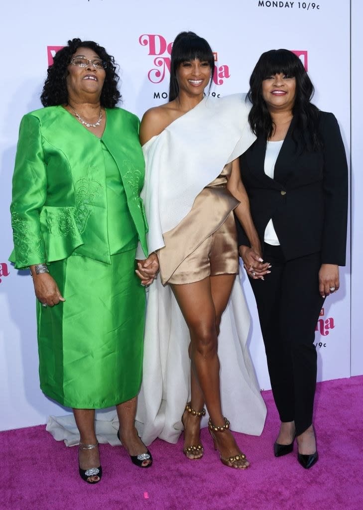 Ciara on the red carpet hand-in-hand with her mom and grandmother