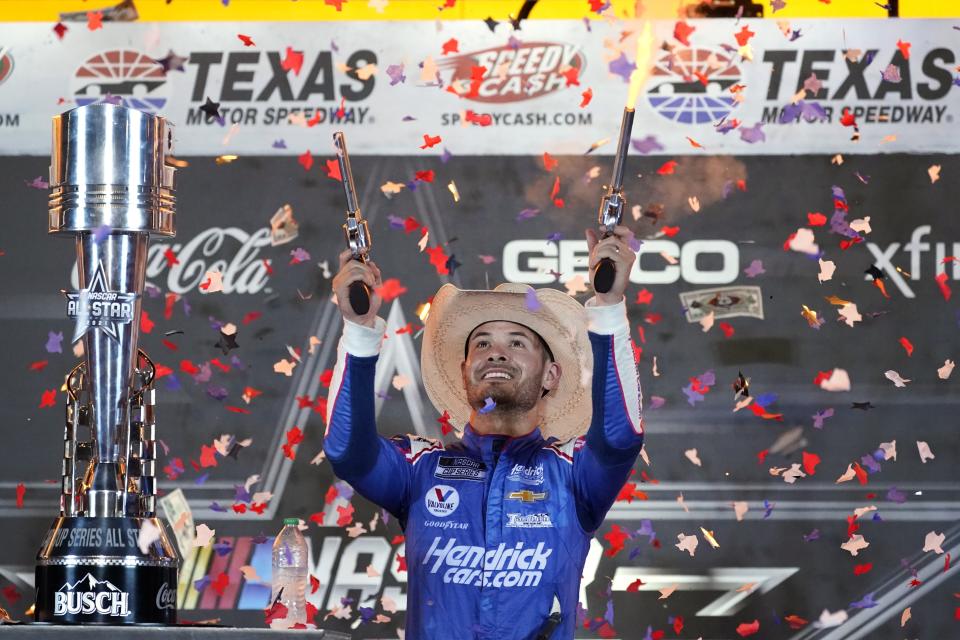 Kyle Larson celebrates in Victory Lane after winning the NASCAR Cup Series All-Star auto race at Texas Motor Speedway in Fort Worth, Texas, Sunday, June 13, 2021. (AP Photo/Tony Gutierrez)