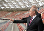 FILE PHOTO: Russian President Vladimir Putin listens to Moscow Mayor Sergei Sobyanin as they inspect the Luzhniki Stadium, which will host matches of the 2018 FIFA World Cup, in Moscow, Russia September 9, 2017. Sputnik/Alexei Druzhinin/Kremlin via REUTERS/File Photo