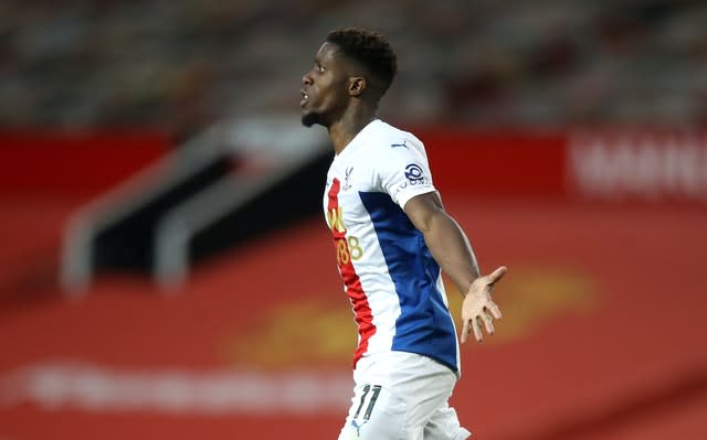 Wilfried Zaha celebrates wrapping up Crystal Palace's 3-1 win at Old Trafford