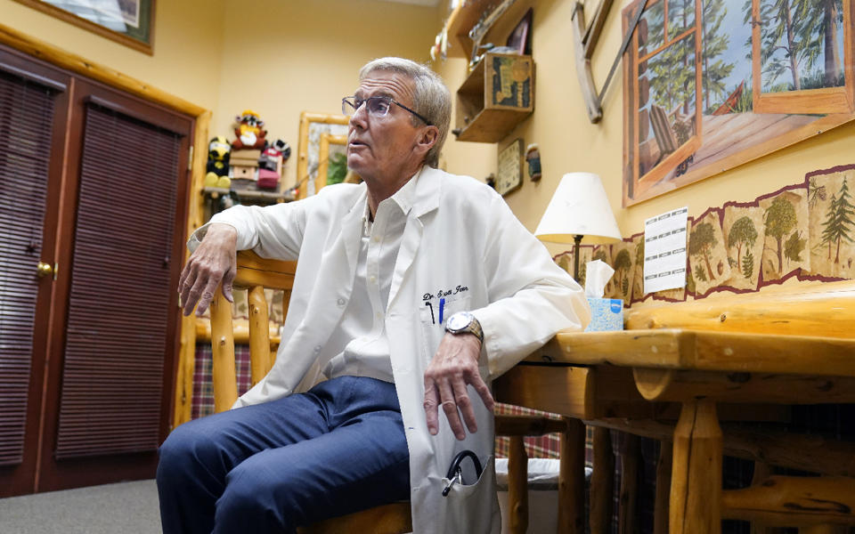 Dr. Scott Jensen, shown at his Watertown, Minn., clinic, on Sept. 22, 2021, is a family physician now running for governor. He's become the frontrunner for the GOP nomination on a platform of vaccine skepticism and opposition to the restrictions that Democratic Gov. Tim Walz and President Joe Biden have used to manage the pandemic. AP Photo/Jim Mone)