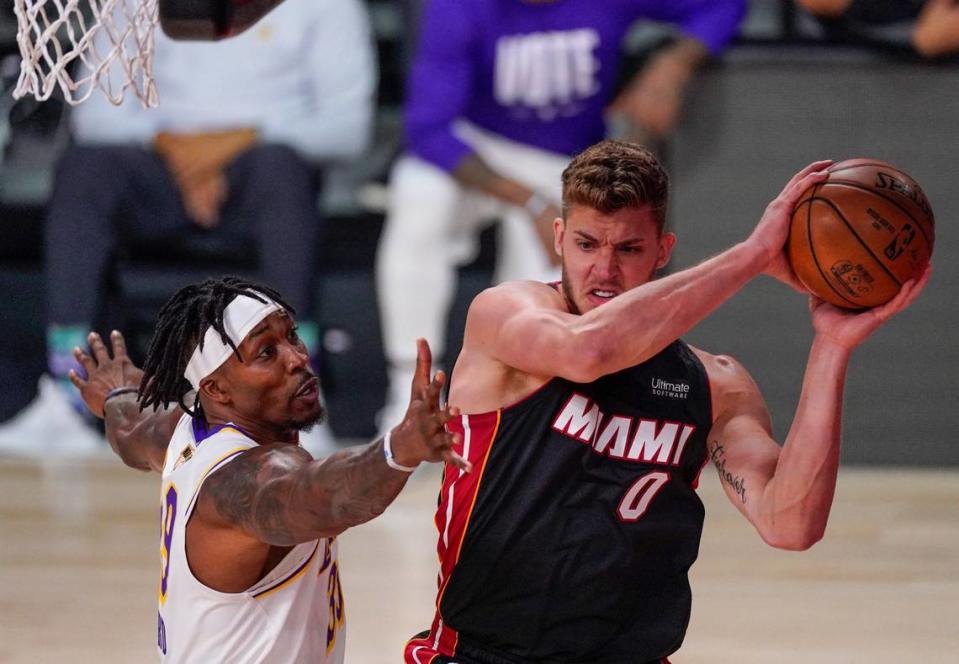 Miami Heat center Meyers Leonard (0) controls the ball against Los Angeles Lakers center Dwight Howard (39) during the second half in Game 3 of the NBA Finals on Oct. 4, 2020, in Lake Buena Vista.