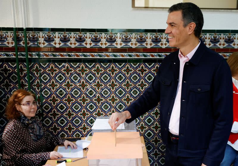 Spain's Prime Minister Pedro Sanchez casts his vote at a polling station during regional elections, in Madrid