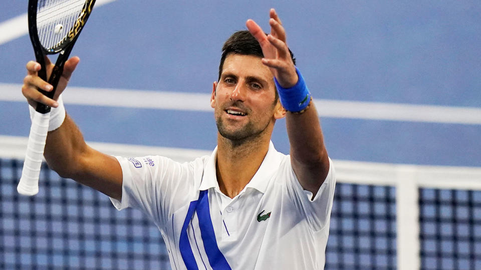 Pictured here, Novak Djokovic performs his customary post-match celebration.