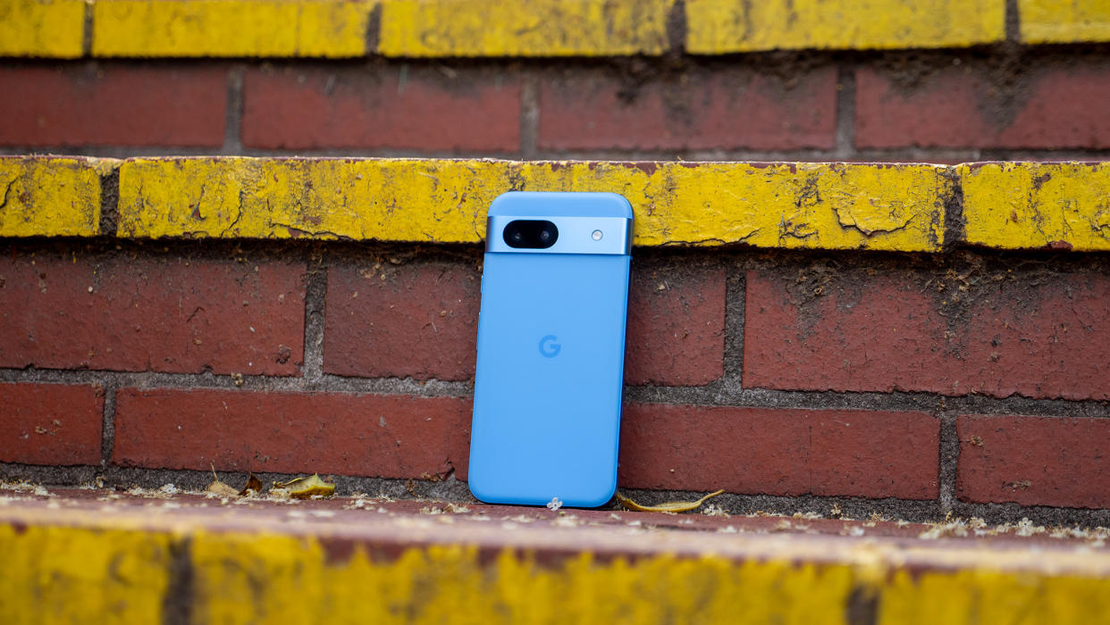  A Bay blue Google Pixel 8a on a staircase. 