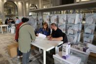 Ballot boxes are distributed to polling station staff ahead of Lebanon's first election since a currency collapse plunged most of its population into poverty (AFP/ANWAR AMRO)