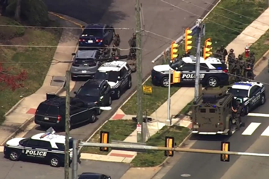 Police surround the woman's vehicle. (NBC Washington)