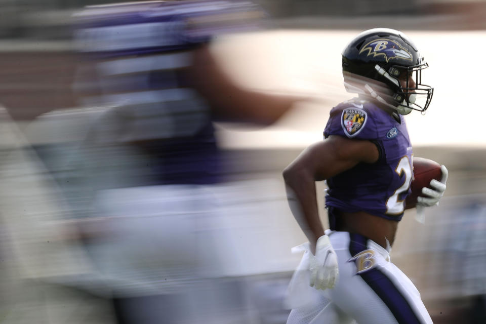 Running back J.K. Dobbins of the Baltimore Ravens trains during the Baltimore Ravens' training camp. (Photo by Patrick Smith/Getty Images)