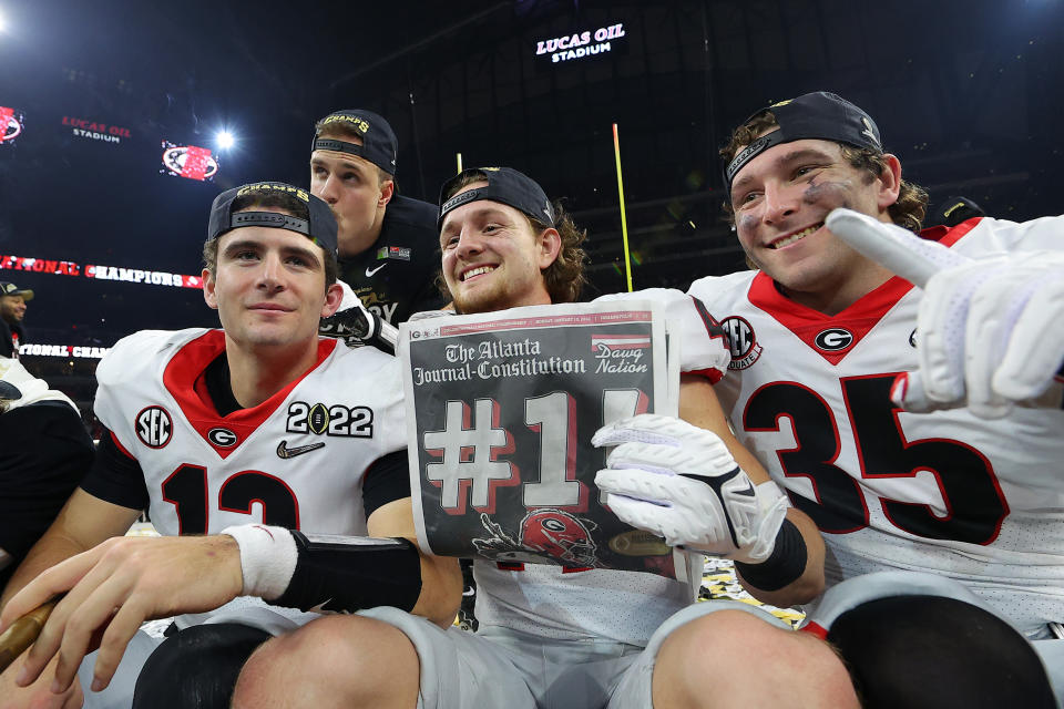 Georgia Bulldogs players celebrate after wining the 2022 CFP National Championship Game. (Photo by Kevin C. Cox/Getty Images)<br>