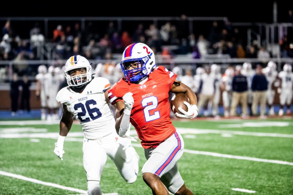 The Bartlett Panthers Jeremiah "Snap" Reed rushes toward the end zone against the Beech Buccaneers Darius Johnson in the semi-finals on Nov. 25, 2022 at Bartlett High School stadium in Bartlett, TN.