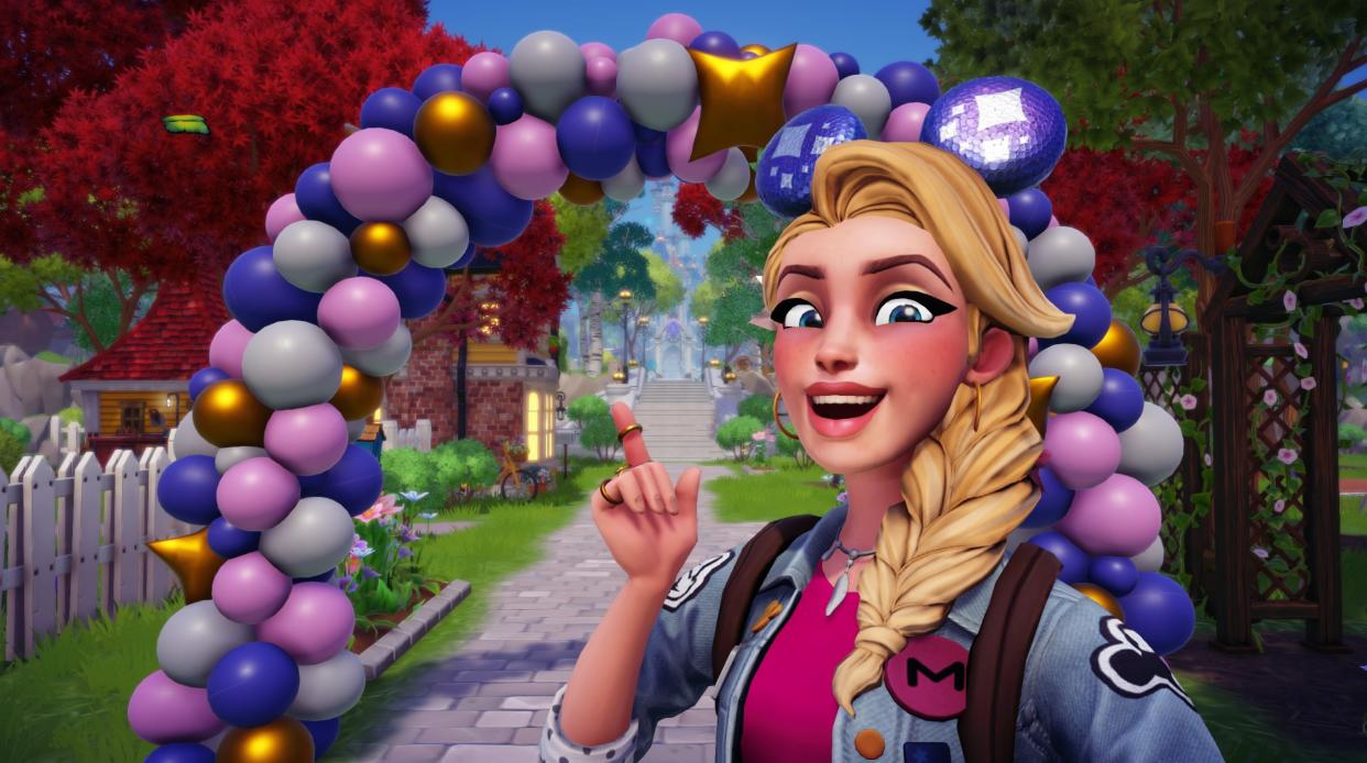  Disney Dreamlight Valley codes - A player smiles and points to a large balloon arch while wearing sparkly mickey mouse ears. 