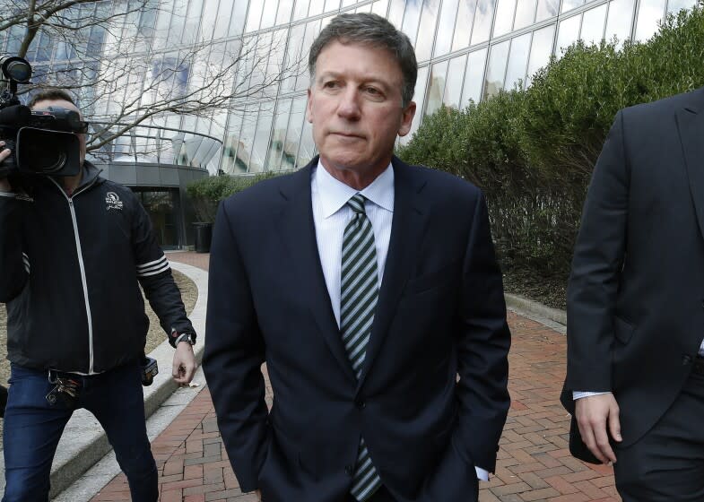 FILE - Bruce Isackson departs federal court, April 3, 2019, in Boston after facing charges in a nationwide college admissions bribery scandal. Isackson is scheduled to be sentenced on June 28, 2022. (AP Photos/Michael Dwyer, File)