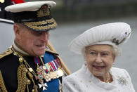 The Queen smiling at Prince Philip while they are both aboard the flotilla for her Diamond Jubilee in 2012. More than 1,000 boats from the Commonwealth paraded down the Thames, the largest flotilla seen on the river for centuries.