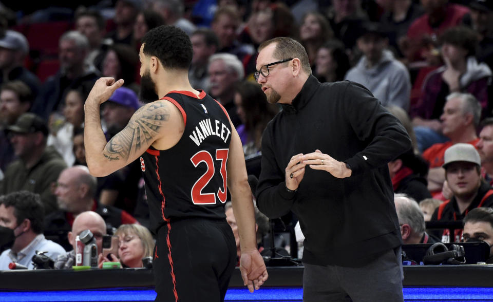 Toronto Raptors coach Nick Nurse, right, speaks with guard Fred VanVleet during the first half of the team's NBA basketball game against the Portland Trail Blazers in Portland, Ore., Saturday, Jan. 28, 2023. (AP Photo/Steve Dykes)