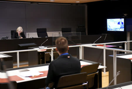 The initial remand hearing of Abderrahman Mechkah (lying in a hospital bed, attending the court session via video), 18 year-old Moroccan man suspected of killing two people and attempting to kill eight others with terrorist intent in Turku, on Friday, August 19, is held at Southwest Finland District Court in Turku, Finland, August 22, 2017. LEHTIKUVA /Martti Kainulainen via REUTERS