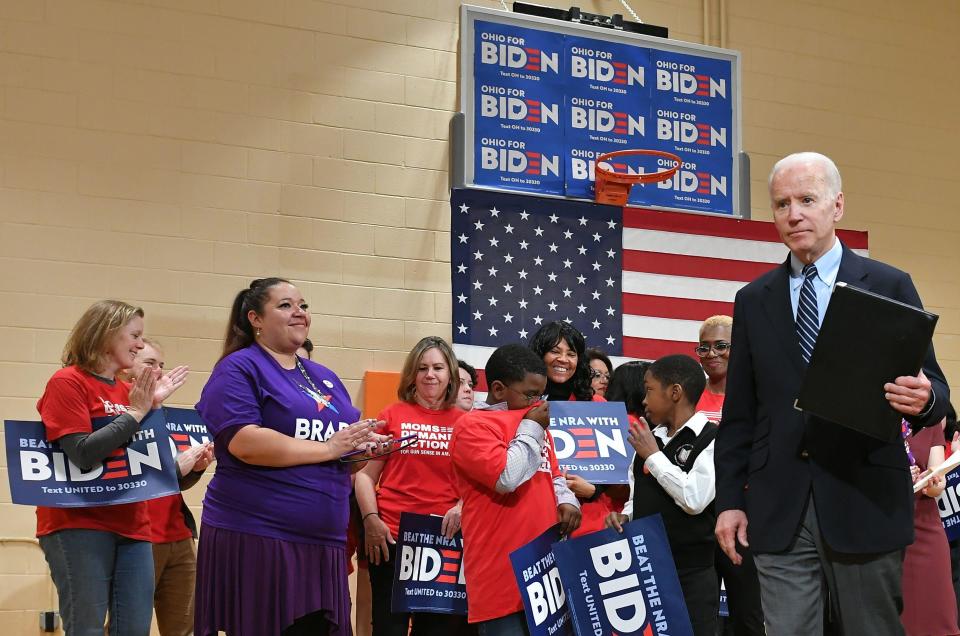 Democratic presidential candidate Joe Biden walks off the stage after speaking during a campaign stop at Driving Park Community Center in Columbus, Ohio on March 10, 2020.  / Credit: MANDEL NGAN/AFP via Getty Images