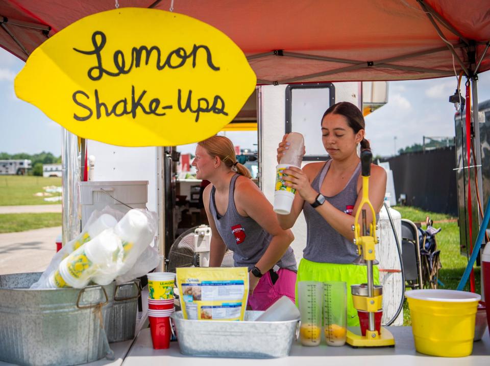 Alex Garcia makes a lemon shake-up at the Weenie Wagon at the Monroe County Fair at the Monroe County Fairgrounds on Monday, July 3, 2023.