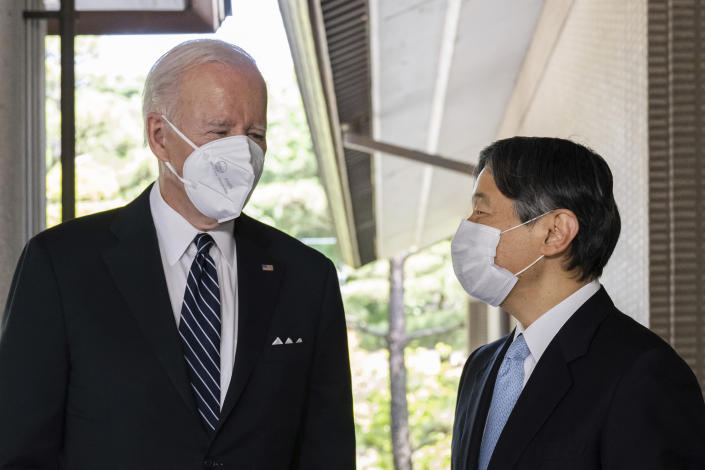 Japan's Emperor Naruhito, right, greets U.S. President Joe Biden prior to their meeting at the Imperial Palace in Tokyo Monday, May 23, 2022. (Saul Loeb/Pool Photo via AP)