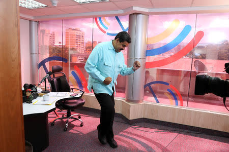 Venezuela's President Nicolas Maduro dances during his radio program at Miraflores Palace in Caracas, Venezuela. Miraflores Palace/Handout via REUTERS