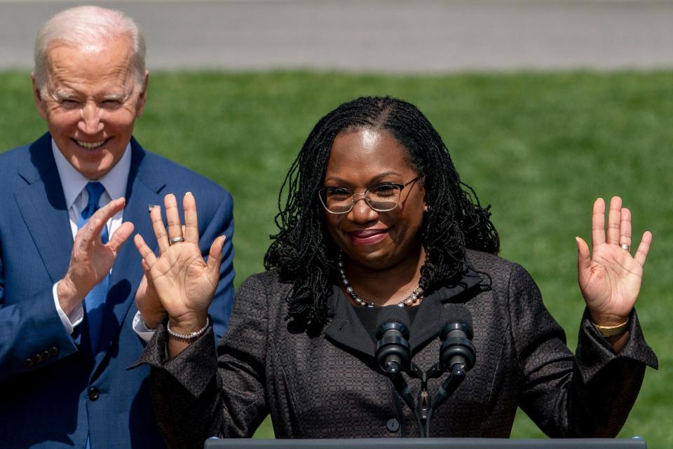 Judge Ketanji Brown Jackson, accompanied by President Joe Biden, waves as she takes the podium to speak during an event on the South Lawn of the White House in Washington, Friday, April 8, 2022, celebrating her confirmation as the first Black woman to reach the Supreme Court.