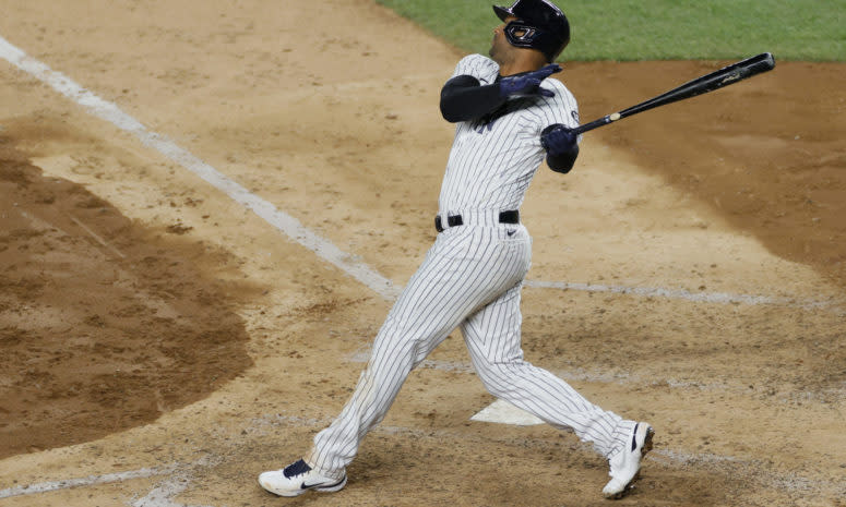 Aaron Hicks follows through on a swing at the plate