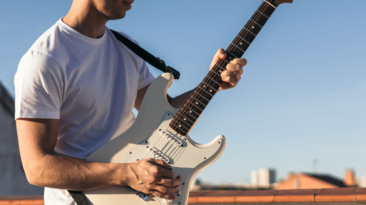  Man playing electric guitar 