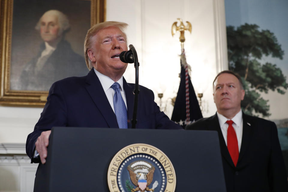 President Donald Trump, accompanied by Secretary of State Mike Pompeo, speaks Wednesday, Oct. 23, 2019, in the Diplomatic Room of the White House in Washington. (AP Photo/Jacquelyn Martin)