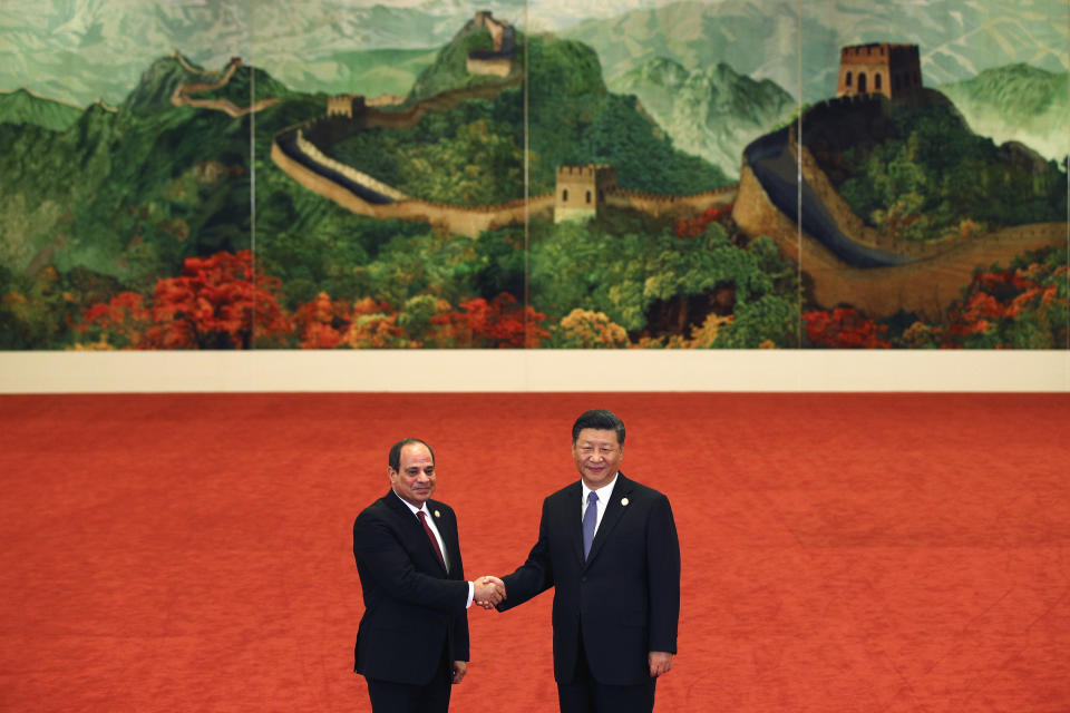 FILE- Egypt's President Abdel Fattah al-Sisi, left, shakes hands with Chinese President Xi Jinping during the Forum on China-Africa Cooperation held at the Great Hall of the People in Beijing, Monday, Sept. 3, 2018. The U.S., Britain and a handful of others aren’t sending dignitaries to the Beijing Games as part of a diplomatic boycott, but the Chinese capital is still attracting an array of world leaders for the opening ceremony on Friday, Feb. 4, 2022. Egypt is also among those whose governments have boosted ties with Beijing, as el-Sissi seeks to move away from Western leaders who have concerns over his human rights record. (AP Photo/Andy Wong, Pool, File)