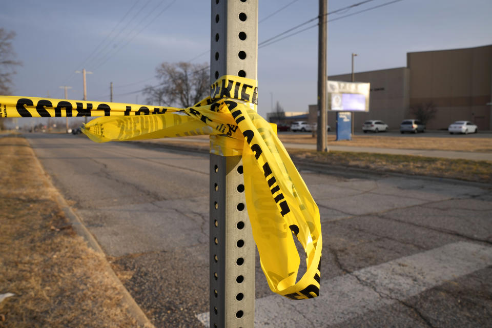 Sheriff's tape is seen on a post outside of Perry High School following a shooting Thursday at the school, Friday, Jan. 5, 2024, in Perry, Iowa. (AP Photo/Charlie Neibergall)