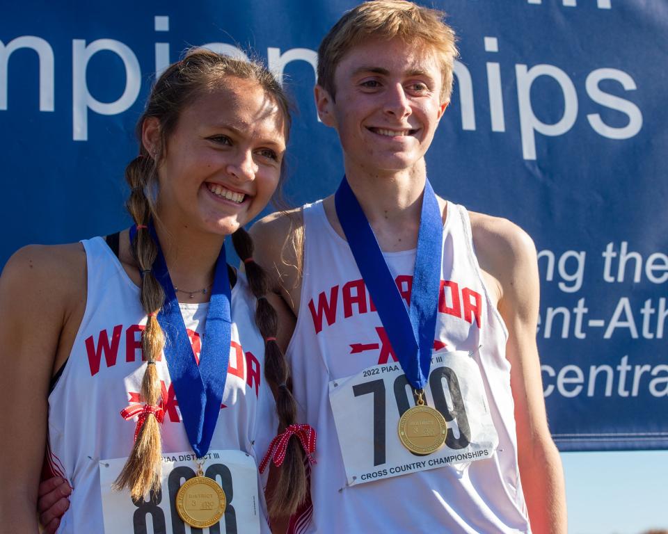 Susquehannock seniors Nicole Dauberman and Matt O’Brien show off their District 3 cross country gold medals at Big Spring High School on Saturday, Oct. 29, 2022.