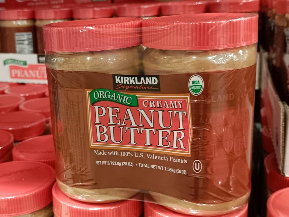 Red and brown package of kirkland peanut butter at costco