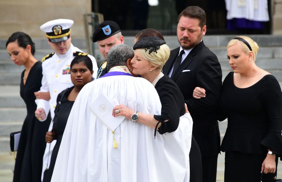 1) Cindy McCain embraces Reverend Rosemarie Logan Duncan at the end of a memorial service on September 1