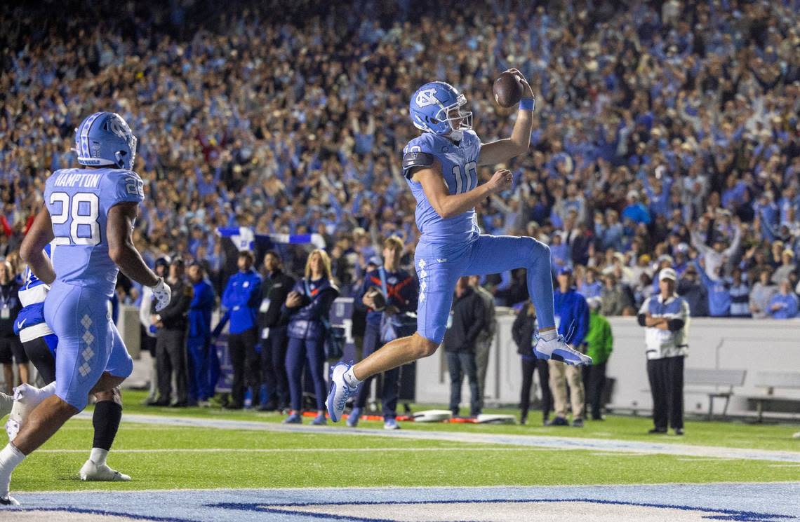 North Carolina quarterback Drake Maye (10) scores on a one-yard run to give the Tar Heels a 7-0 lead against Duke in the first quarter on Saturday, Nov. 11, 2023 at Kenan Stadium in Chapel Hill, N.C.