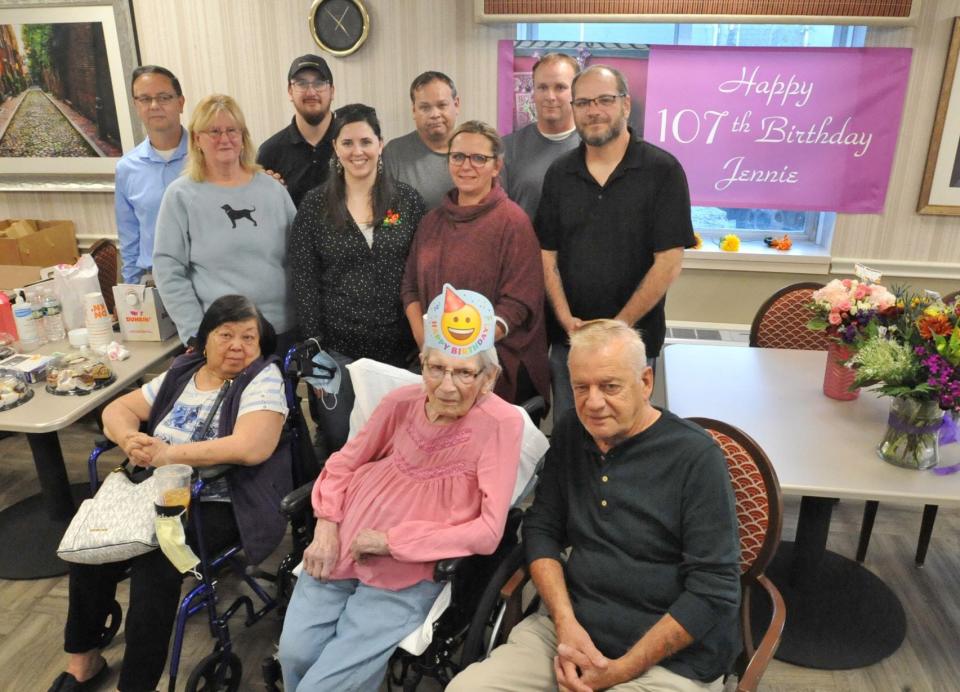 Jennie Zaborski, seated center, celebrates her 107th birthday with 10 relatives. Seated at left, daughter-in-law May Zaborski; seated right, son Teddy Zaborski. Back, from left, grandson Paul Zaborski and his wife, Jeanne Zaborski; great-grandson Michael Zaborski and his wife, Michelle Zaborski; grandson Billy Mathews; granddaughter Karen Coyle; and grandsons Arthur Mathews and Wayne Mathews, at the Webster Park Rehab and Nursing Center in Rockland on Monday, Nov. 1, 2021.