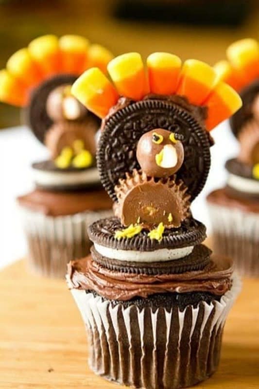<p>Brown Eyed Baker</p><p>Decorate with oreo cookies, whoppers, peanut butter cups, candy corn and icing.</p><p><strong>Get the recipe: </strong><a href="https://www.browneyedbaker.com/thanksgiving-turkey-cupcakes/" rel="nofollow noopener" target="_blank" data-ylk="slk:Thanksgiving Turkey Cupcakes;elm:context_link;itc:0;sec:content-canvas" class="link "><strong>Thanksgiving Turkey Cupcakes</strong></a></p>
